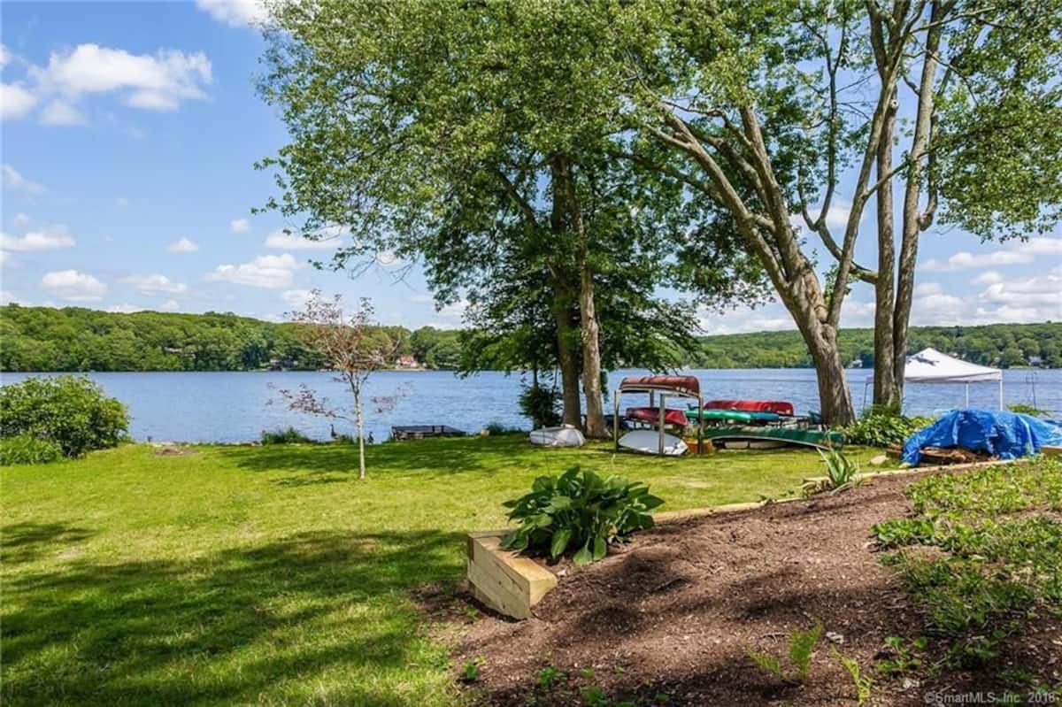 View across the private lake from the Andover lakefront home